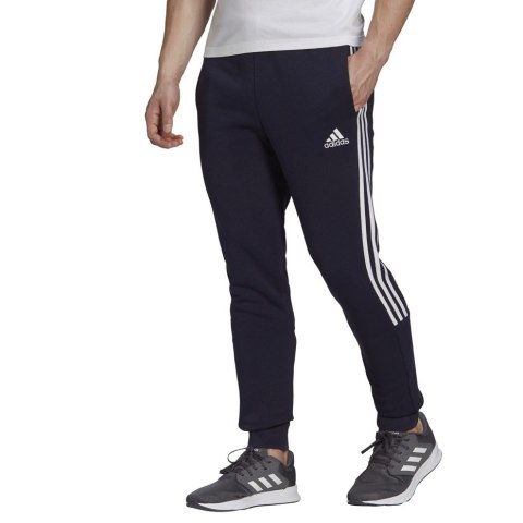 Adidas Spodnie męskie adidas Essentials Tapered Cuff 3 Stripes granatowe GK8977