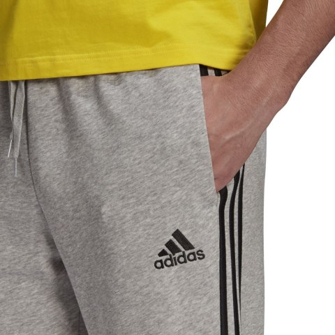 Adidas Spodnie męskie adidas Essentials Tapered Cuff 3 Stripes szare GK8889