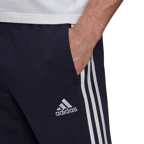 Adidas Spodnie męskie adidas Essentials Tapered Elastic Cuff 3 Stripes Pant granatowe GK8830