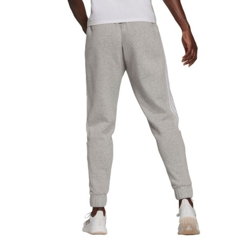 Adidas Spodnie damskie adidas Essentials Colorblock Block Cut 3-Stripes Regular Tapered Pants szare HB2768