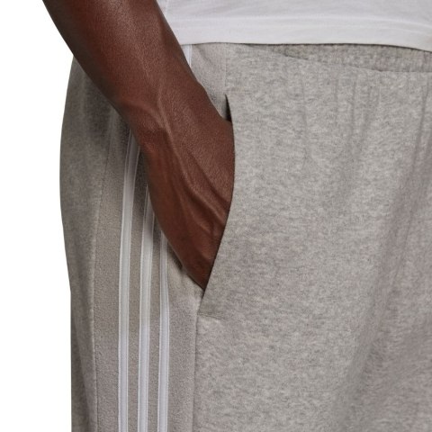 Adidas Spodnie damskie adidas Essentials Colorblock Block Cut 3-Stripes Regular Tapered Pants szare HB2768