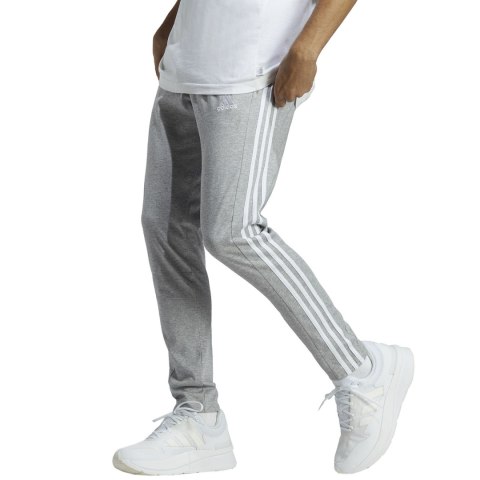 Adidas Spodnie męskie adidas Essentials Single Jersey Tapered Open Hem 3-Stripes szare IC0046